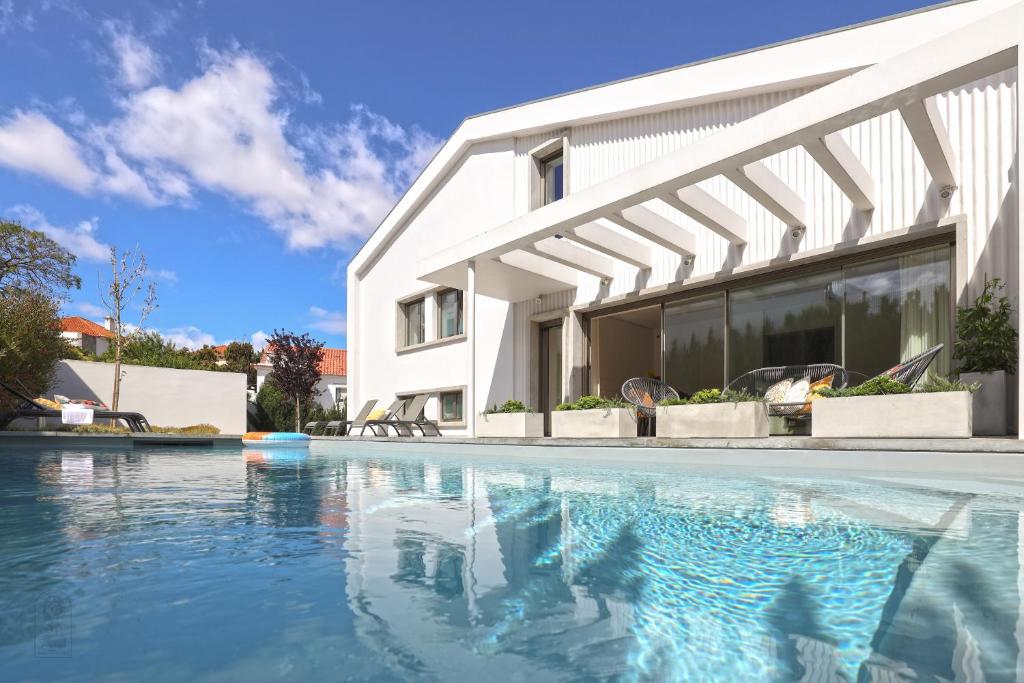 Image of BONITA CASADE HÓSPEDES COM PISCINA E JARDIM